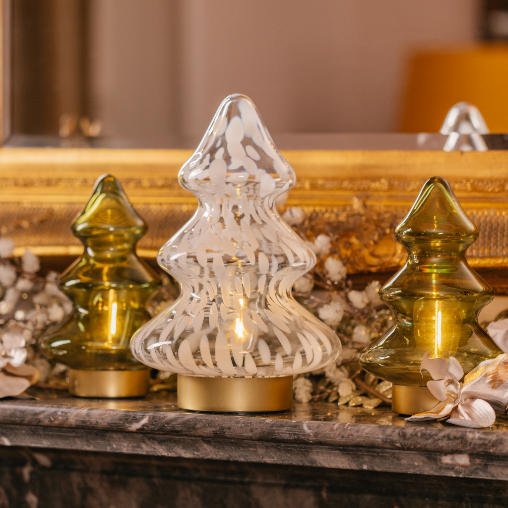Opal white dappled LED tree festive decoration flanked by two smaller peridot green LED Christmas trees on festive mantlescape