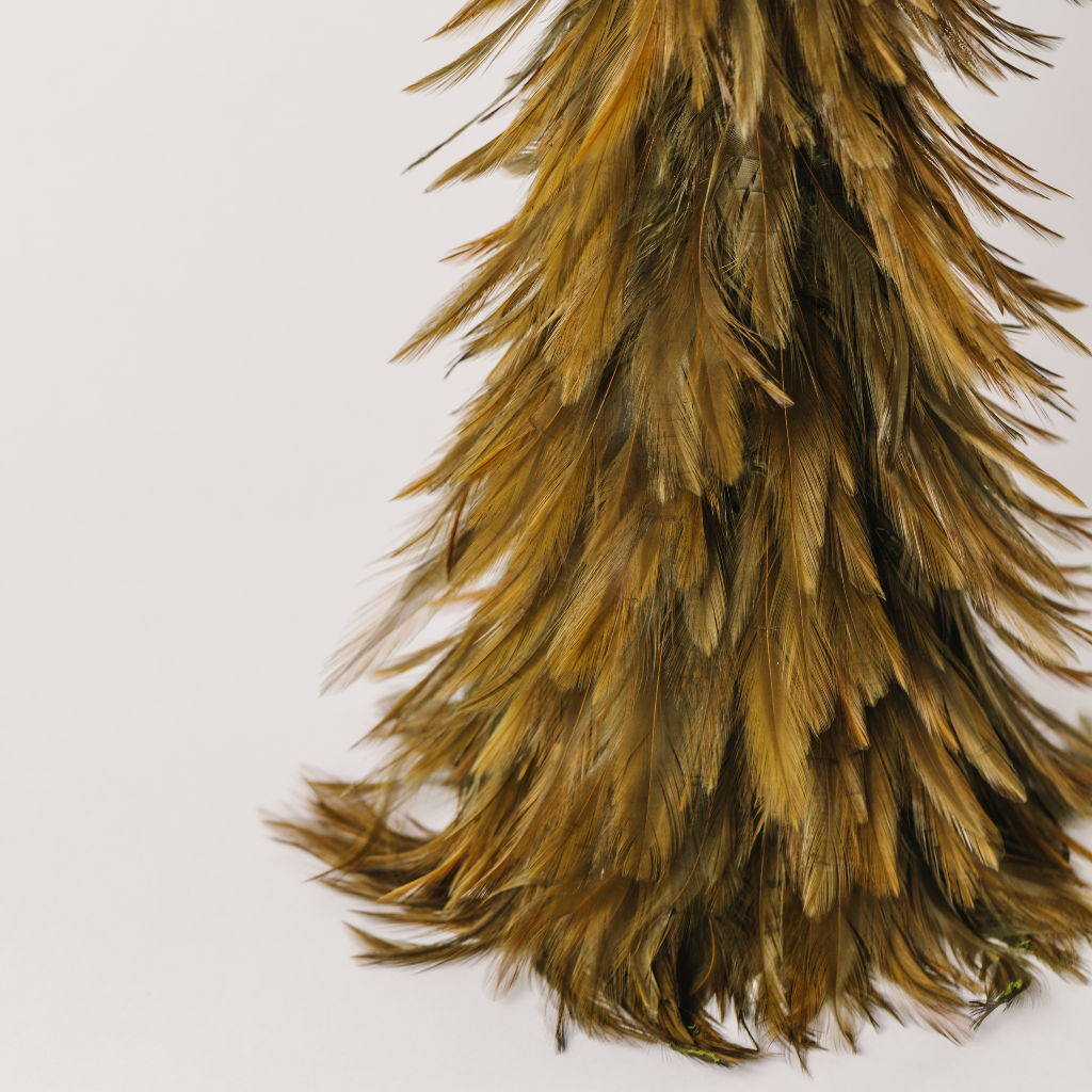 Green lustre on feathers of Christmas tree decoration