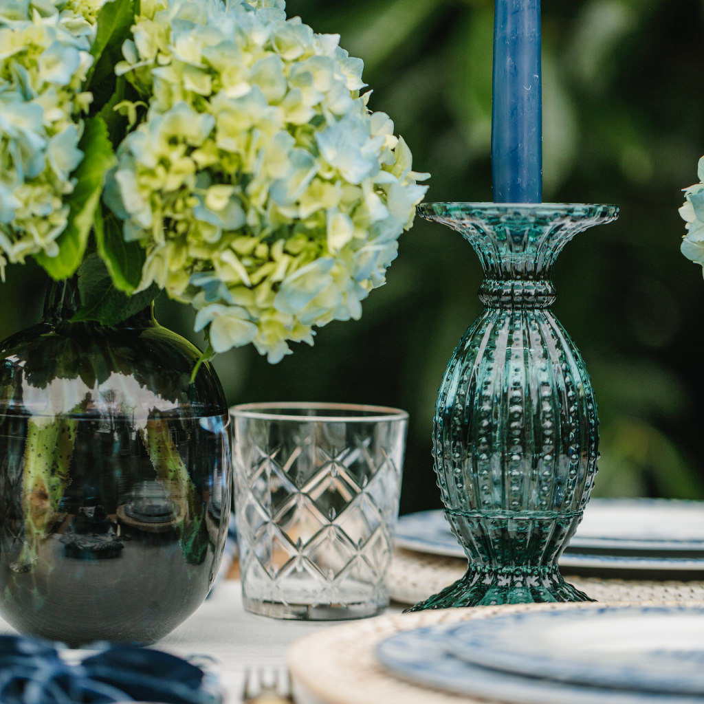 Aquamarine blue cut glass candle holder set with navy blue tapered dinner candle