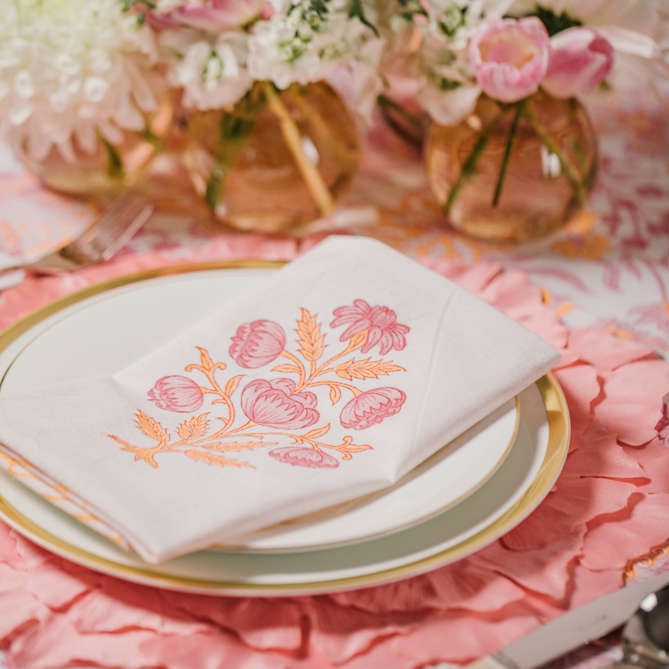 Pink Lily Indian block printed cotton napkins folded on place setting with Coral Leaf pink placemats