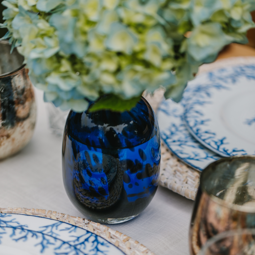 Close up view of royal blue dappled glass vase