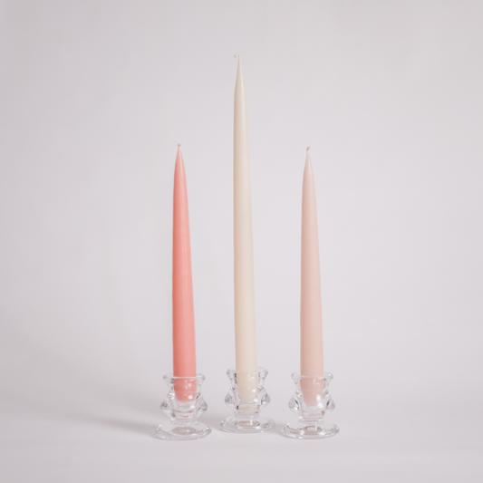 The Peaches and Cream tapered dinner candle set displayed as a trio with a powder pink, vintage rose pink and tall off white tapered candle