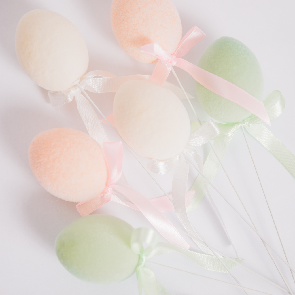 Flocked Easter eggs on wire with ribbon detail in peach, cream and mint green
