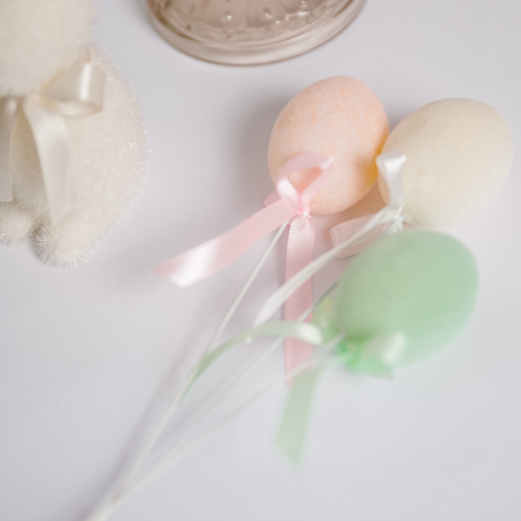 Flocked Easter eggs on wire with ribbon detail in peach, cream and mint green