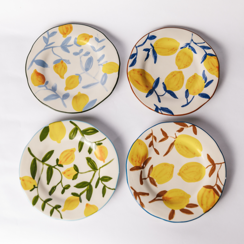 Set of four stoneware yellow lemon and twig design plates