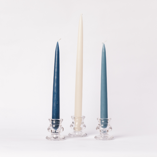 Set of three blue taper dinner candles in different heights