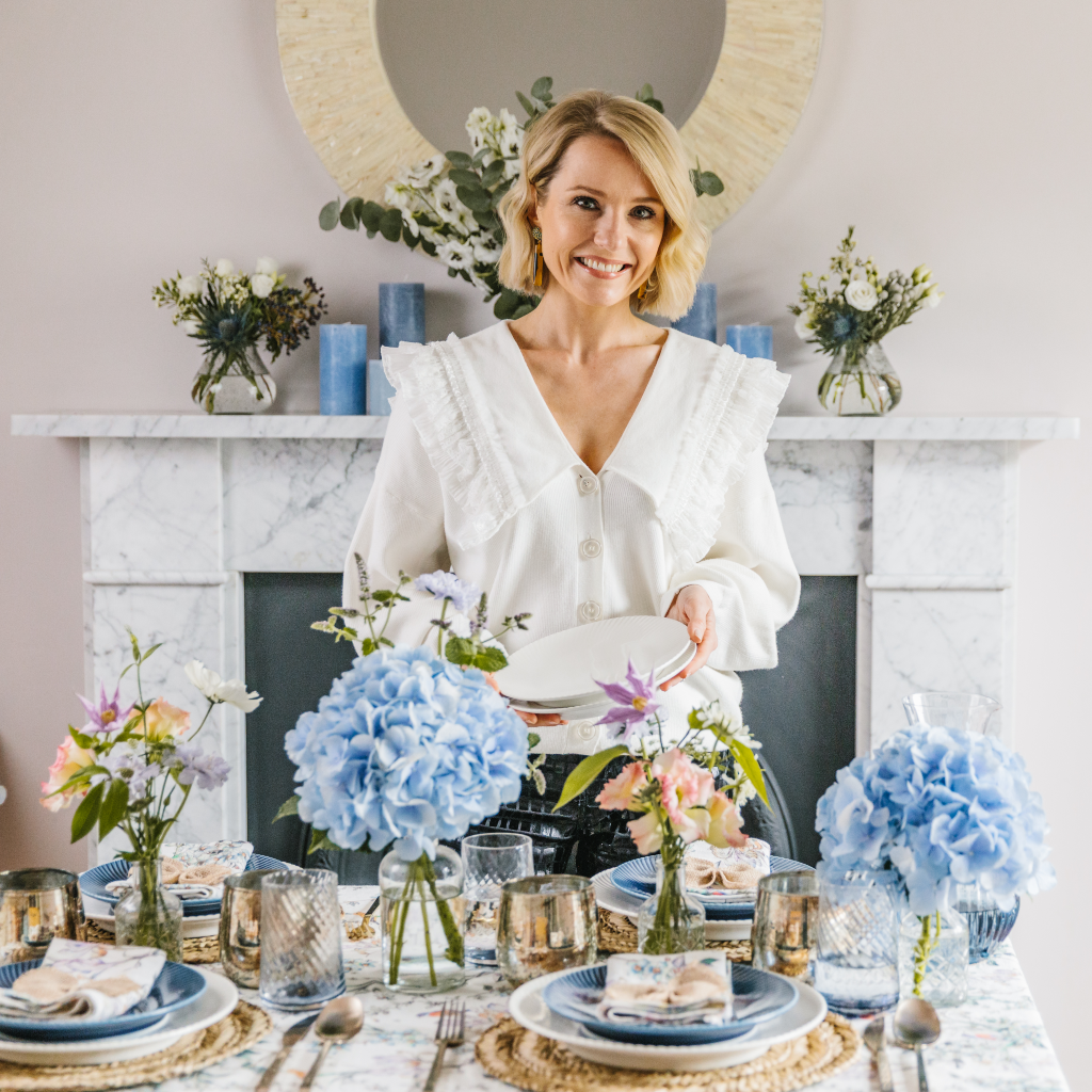 Kate Fairlie, Truffle Tablescapes, in front of the Wildflower Garden Tablescape collection.